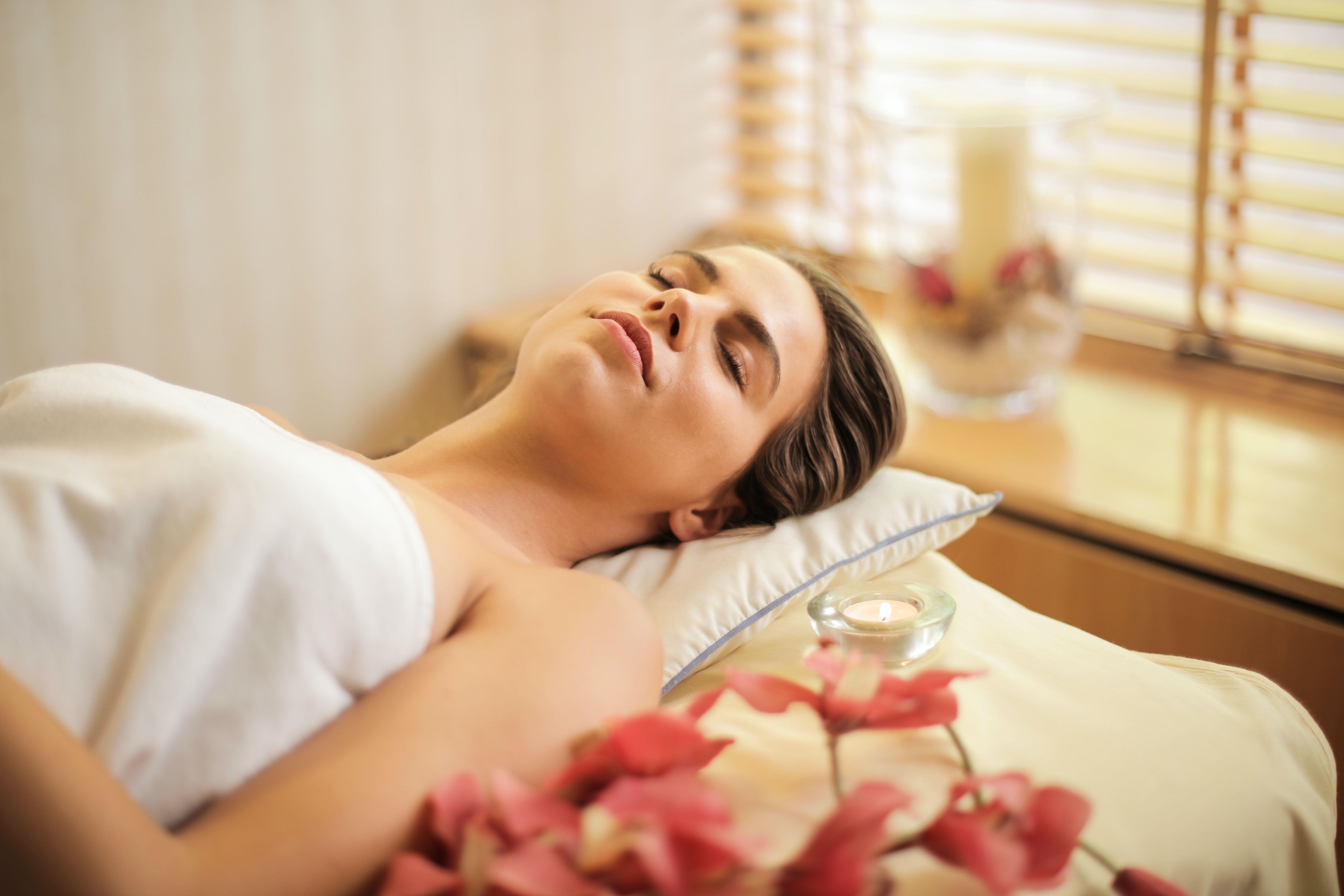 a woman relaxing after a facial service